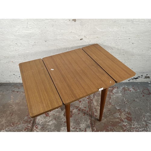 149 - A mid 20th century formica and beech drop leaf kitchen table