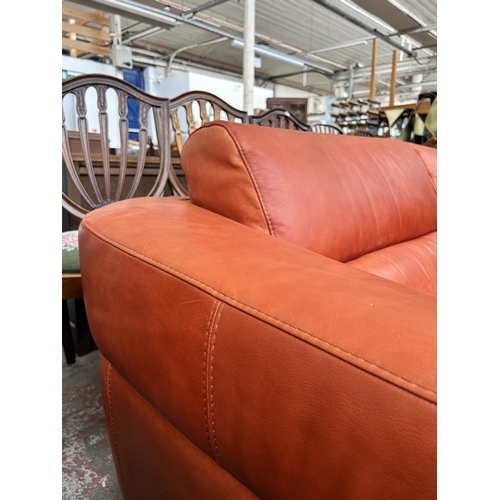 233 - An Italian Marinelli orange leather sofa - approx. 79cm high x 214cm wide x 98cm deep