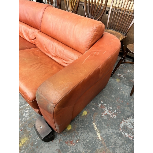 233 - An Italian Marinelli orange leather sofa - approx. 79cm high x 214cm wide x 98cm deep