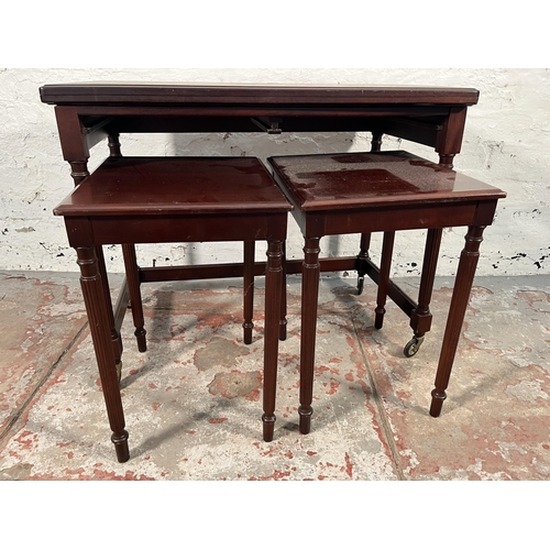 153 - A mahogany nest of three tables