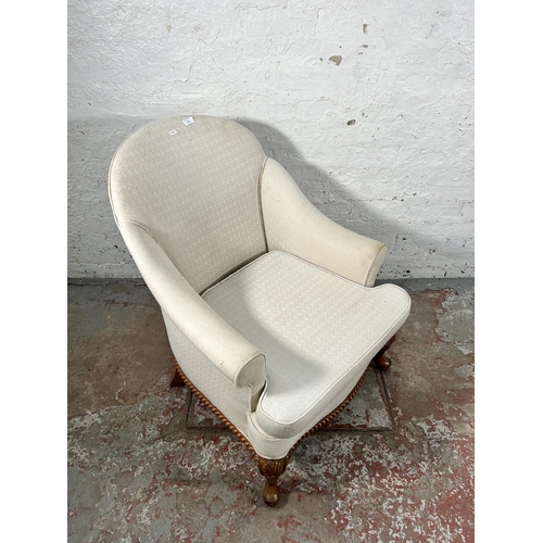 236 - A Georgian style white fabric upholstered and walnut armchair with cabriole supports and shell desig... 