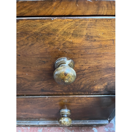 154 - A Victorian walnut chest of two short over three long drawers - approx. 110cm high x 100cm wide x 49... 