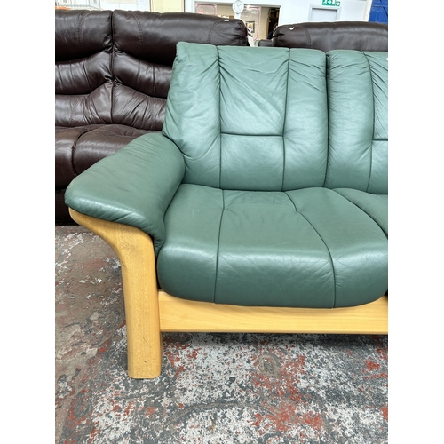 241 - An Ekornes Collection Stressless green leather and beech two seater sofa