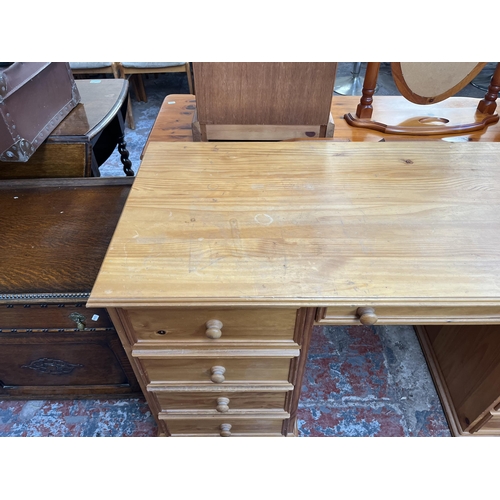 156 - A solid pine pedestal desk - approx. 75cm high x 142cm wide x 59cm deep