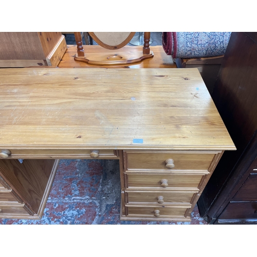 156 - A solid pine pedestal desk - approx. 75cm high x 142cm wide x 59cm deep