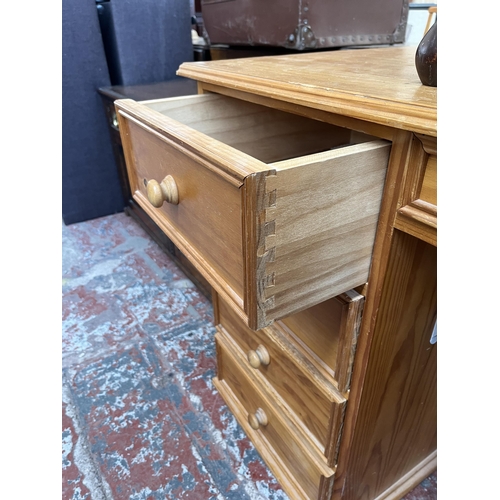 156 - A solid pine pedestal desk - approx. 75cm high x 142cm wide x 59cm deep