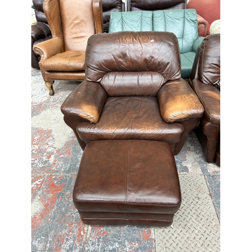 243 - A brown leather five piece lounge suite comprising two seater sofa, two armchairs and two footstools