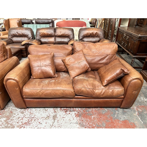 244 - A Duresta tan leather three piece lounge suite comprising three seater sofa, armchair and footstool