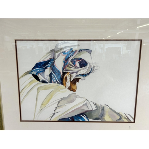 248 - A framed watercolour titled Faces of Oman by Patricia Millns - approx. 65cm high x 79cm wide