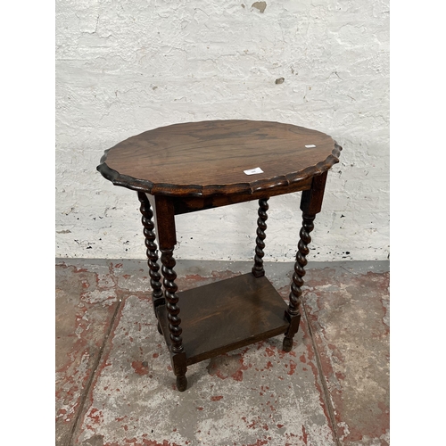 169 - An early/mid 20th century oak pie crust edge side table on barley twist supports