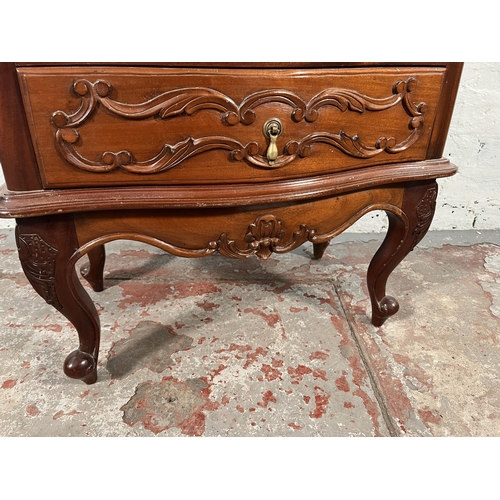 170 - A French style carved mahogany bedside chest of two drawers with cabriole supports