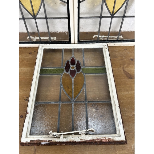 255 - Three 1930's steel framed stained glass windows - largest approx. 64cm high x 99cm wide