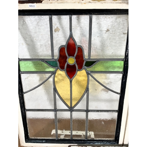 255 - Three 1930's steel framed stained glass windows - largest approx. 64cm high x 99cm wide