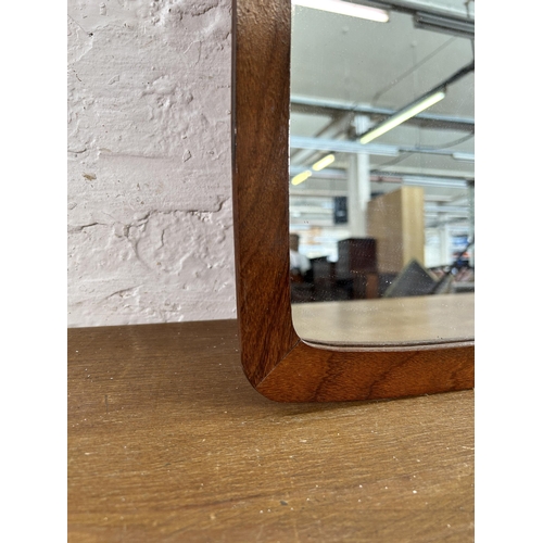 266 - A mid 20th century teak framed wall mirror - approx. 75cm x 35cm