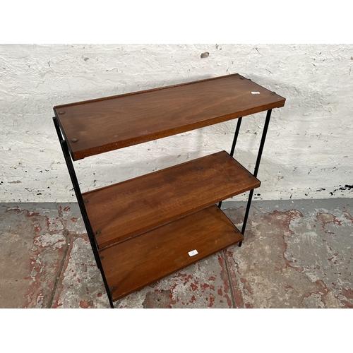 179 - A 1960s teak and black metal three tier shelving unit - approx. 76cm high x 64cm wide x 23cm deep