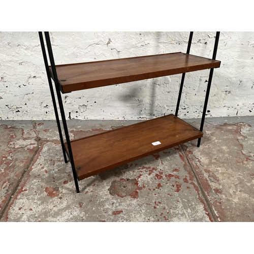 179 - A 1960s teak and black metal three tier shelving unit - approx. 76cm high x 64cm wide x 23cm deep