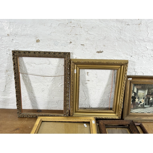 269F - A collection of picture frames together with a P. de Hooch Dutch Interior with Soldiers print and ea... 