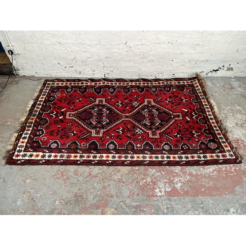 191 - A hand knotted rug made in Iran - approx. 199cm x 120cm