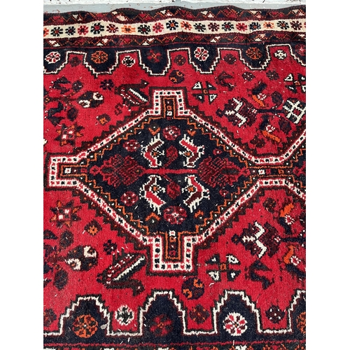 191 - A hand knotted rug made in Iran - approx. 199cm x 120cm