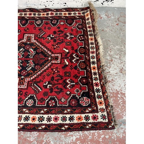 191 - A hand knotted rug made in Iran - approx. 199cm x 120cm