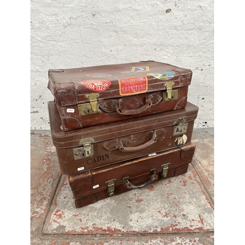 194 - Three vintage brown leather suitcases