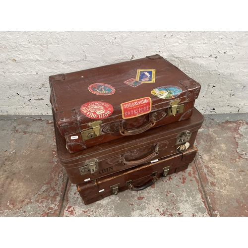 194 - Three vintage brown leather suitcases