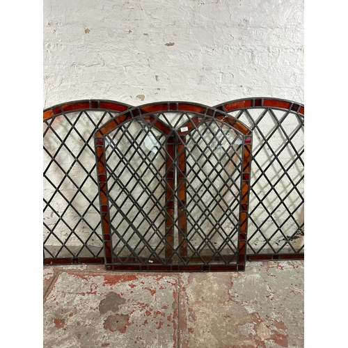 279 - Three stained and leaded glass arched windows - approx. 100cm high x 85cm wide