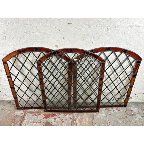 279 - Three stained and leaded glass arched windows - approx. 100cm high x 85cm wide