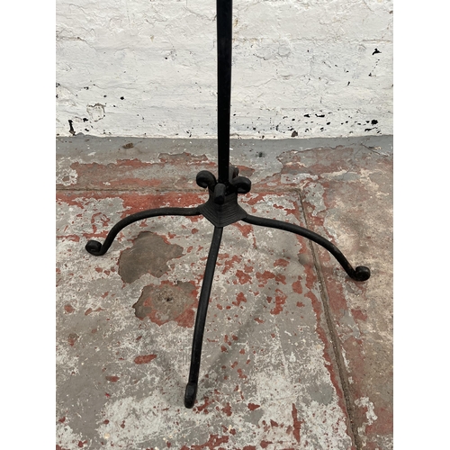 196 - A wrought iron floor standing candelabra - approx. 162cm high