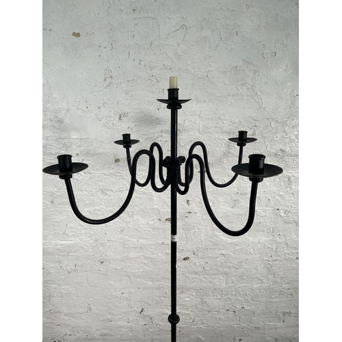 196 - A wrought iron floor standing candelabra - approx. 162cm high