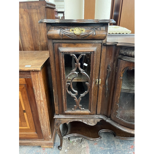 214 - A late 19th/early 20th century mahogany bow fronted glazed sideboard