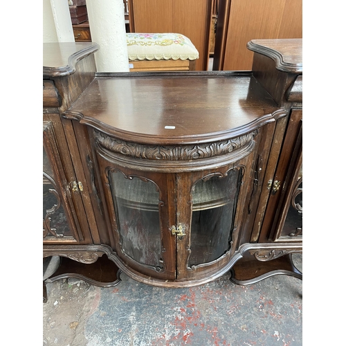 214 - A late 19th/early 20th century mahogany bow fronted glazed sideboard