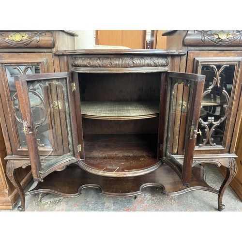 214 - A late 19th/early 20th century mahogany bow fronted glazed sideboard