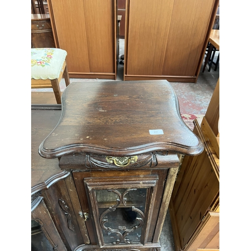 214 - A late 19th/early 20th century mahogany bow fronted glazed sideboard