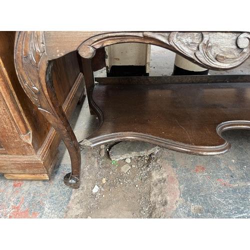 214 - A late 19th/early 20th century mahogany bow fronted glazed sideboard