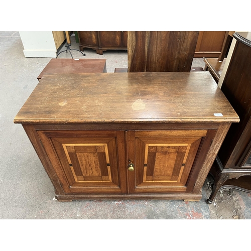 215 - An Edwardian stained pine and inlaid mahogany sideboard