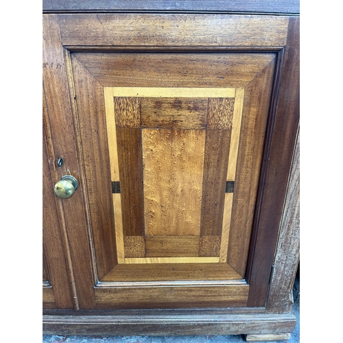 215 - An Edwardian stained pine and inlaid mahogany sideboard