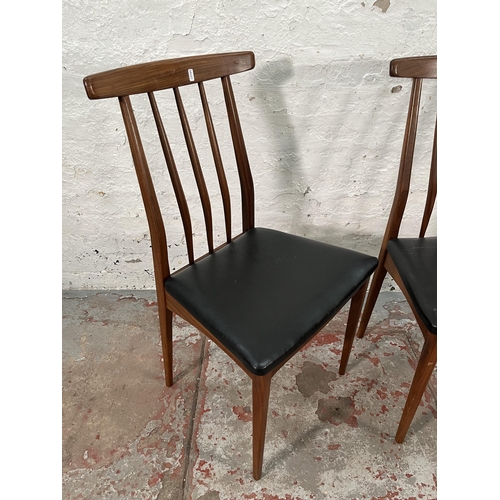 218 - A pair of Younger teak and black vinyl dining chairs