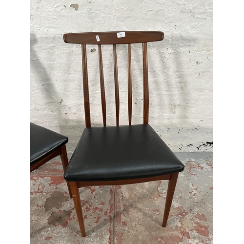 218 - A pair of Younger teak and black vinyl dining chairs