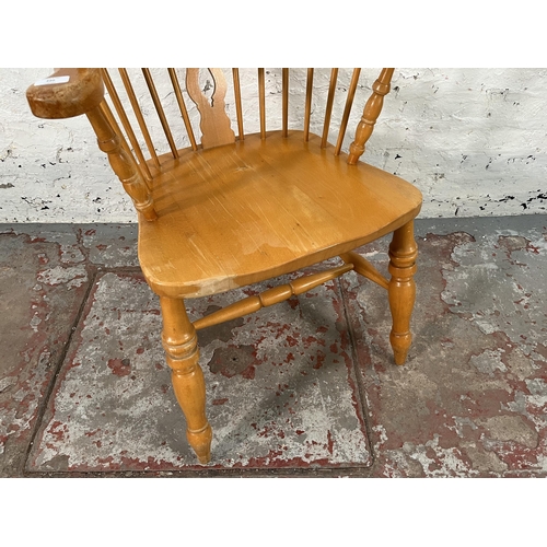 220 - A 19th century style beech Windsor armchair