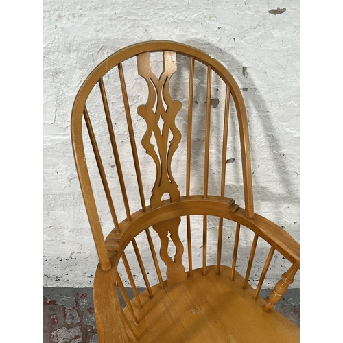 220 - A 19th century style beech Windsor armchair