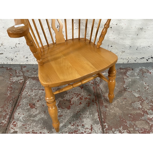 221 - A 19th century style beech Windsor armchair