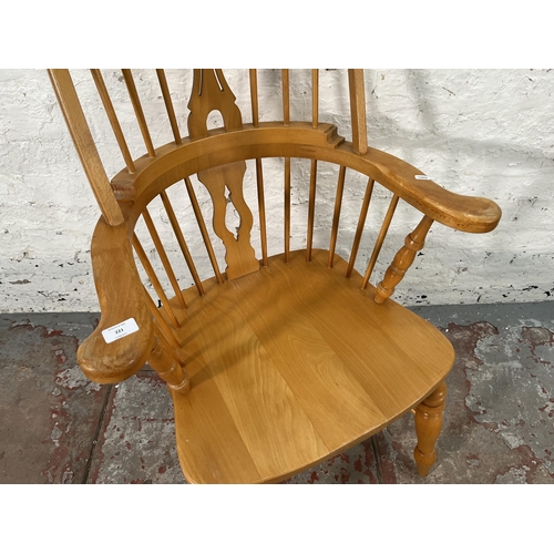 221 - A 19th century style beech Windsor armchair