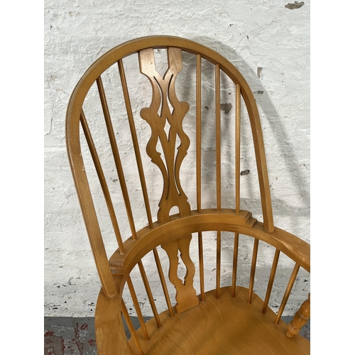 221 - A 19th century style beech Windsor armchair