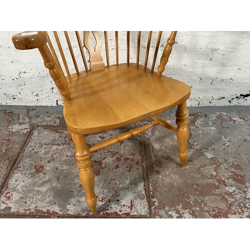 222 - A 19th century style beech Windsor armchair