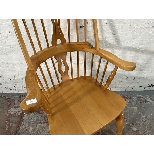 222 - A 19th century style beech Windsor armchair