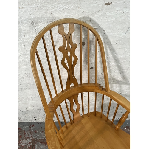 222 - A 19th century style beech Windsor armchair