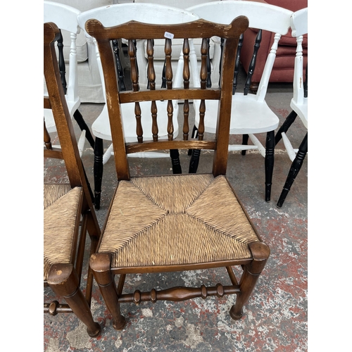 225 - Four 19th century style beech spindle back Lancashire dining chairs with rush seats