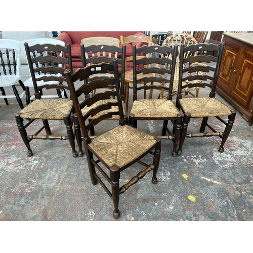 226 - Five 19th century style elm ladder back dining chairs with rush seats