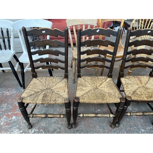 226 - Five 19th century style elm ladder back dining chairs with rush seats